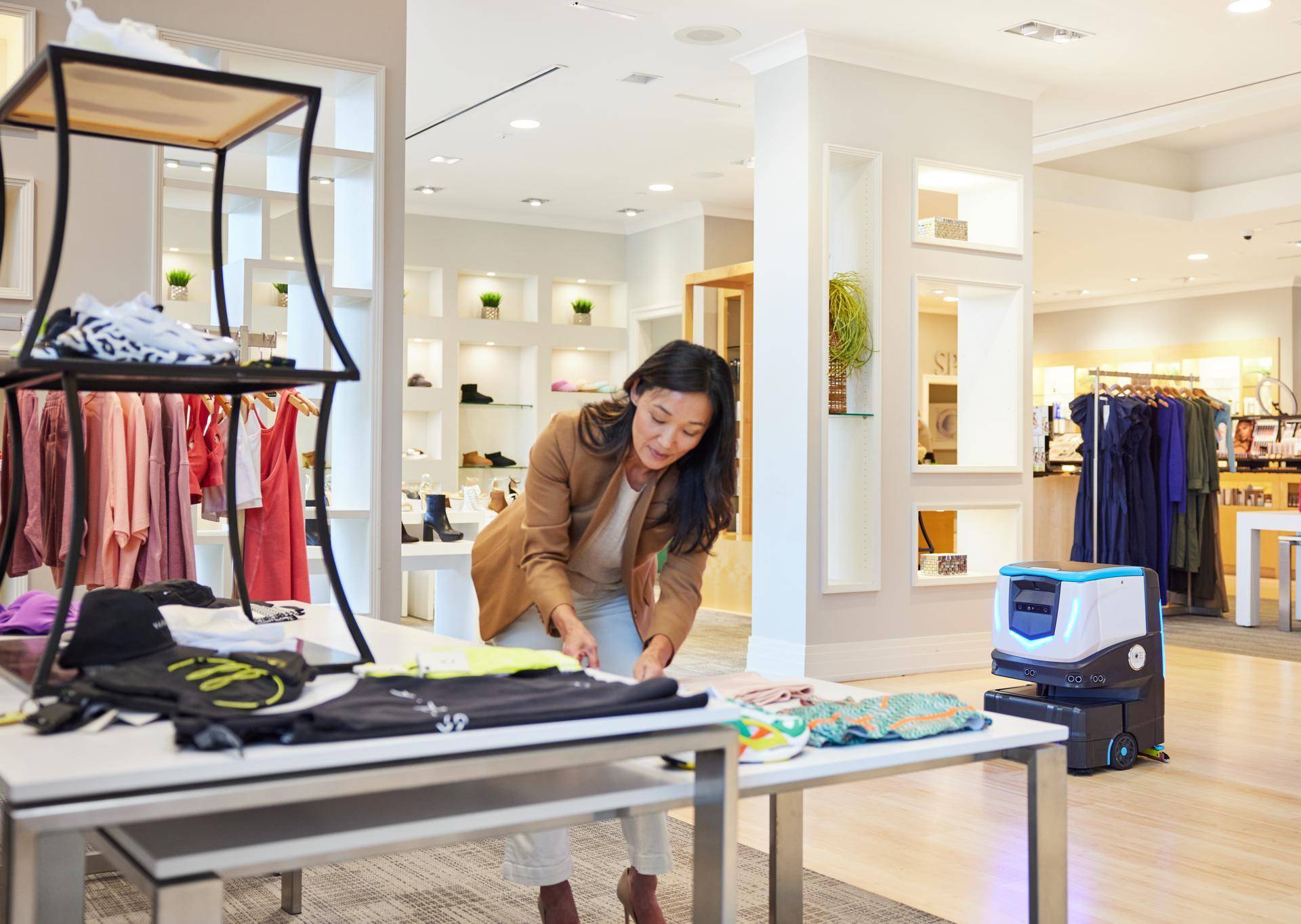 Cobi 18 , robotic floor scrubber, cleaning floors in retail store